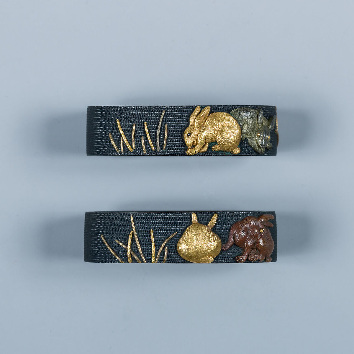 木賊兎図大小揃物 Fittings for a Pair of Swords (<i>Daishō Soroi-Mono</i>), Inscribed by 石黒政美 Ishiguro Masayoshi (Japanese, 1774–1862), Copper-gold alloy (<i>shakudō</i>), gold, silver, copper-silver alloy (<i>shibuichi</i>), copper, Japanese