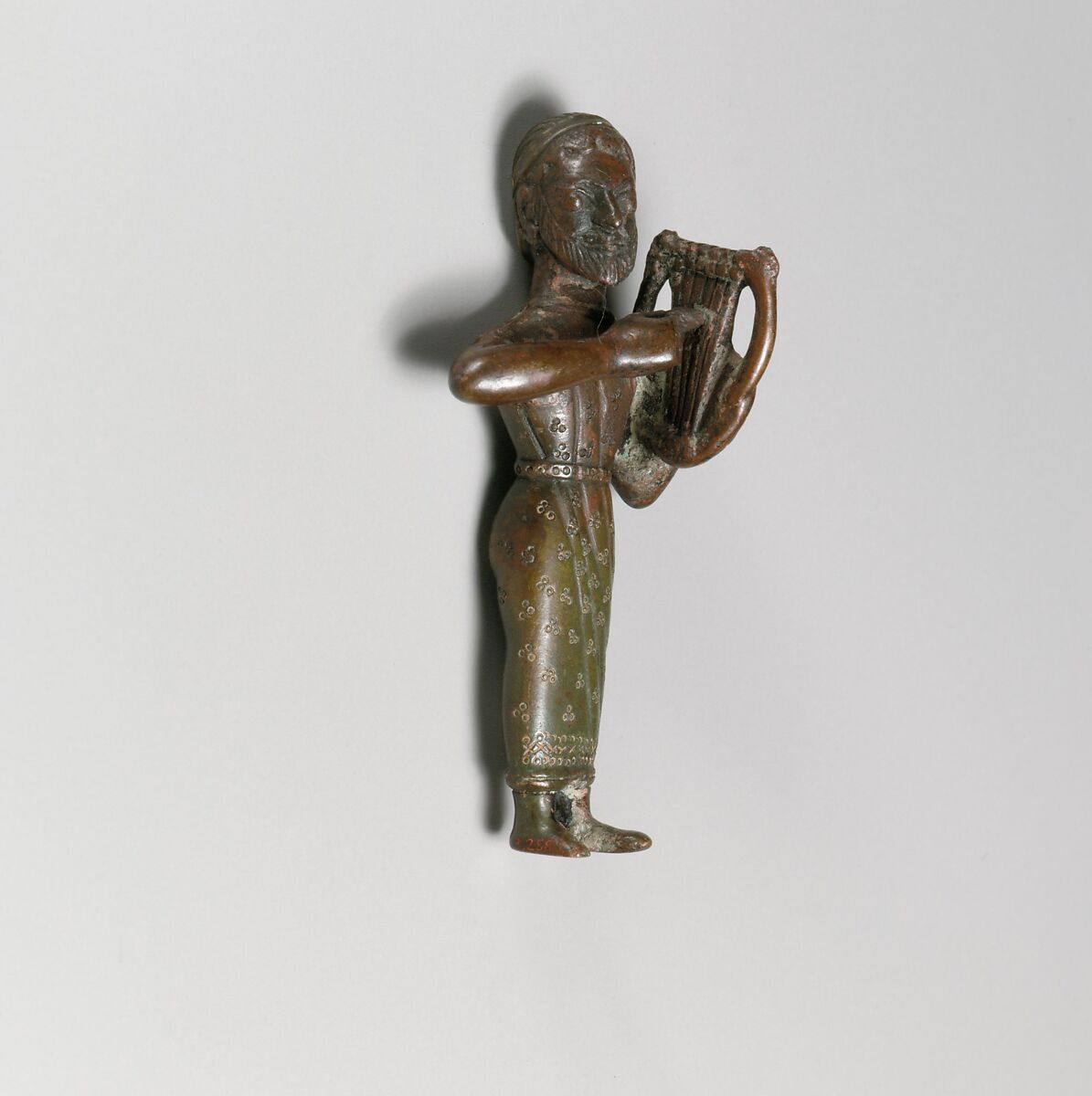 Statuette of a harp (lyre) player, male, Bronze, Greek 