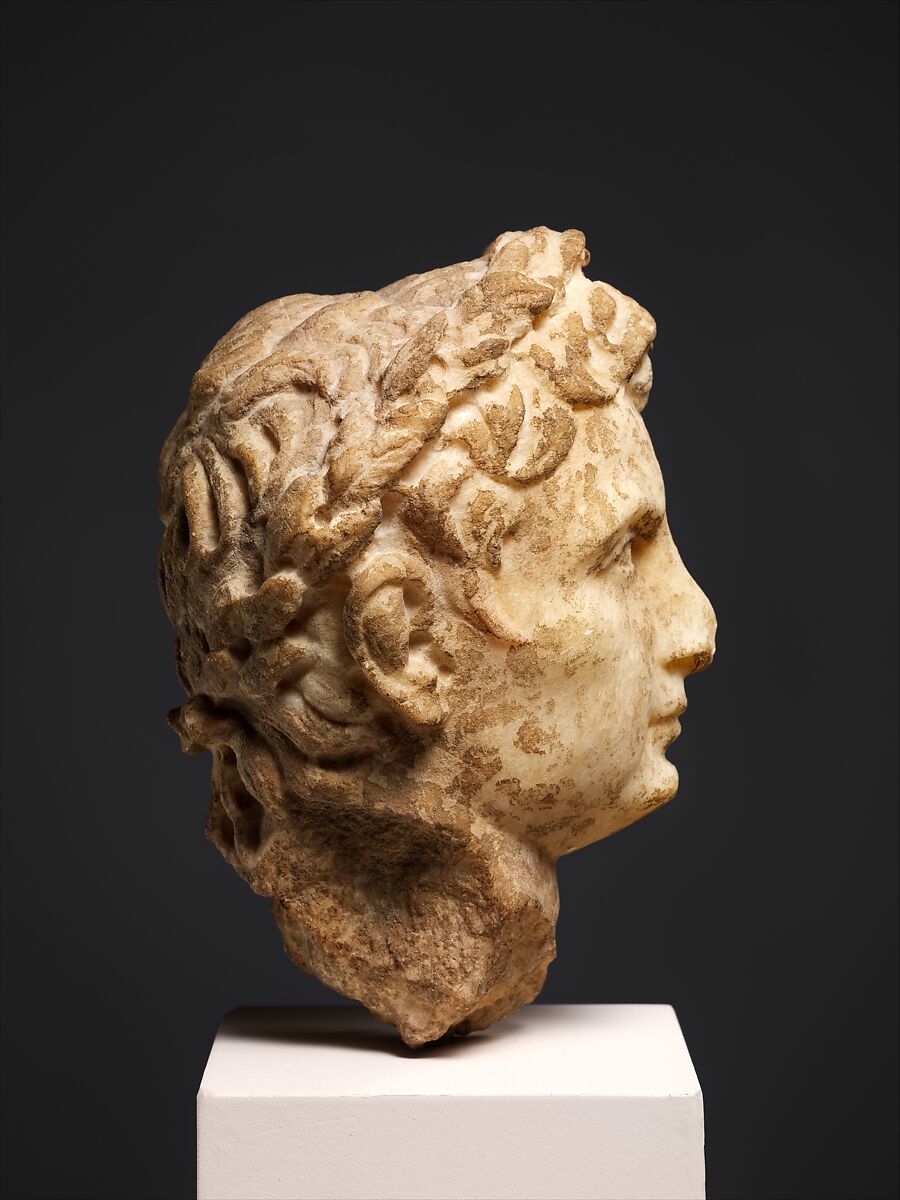 Marble head of a man wearing a laurel wreath, Marble, Roman