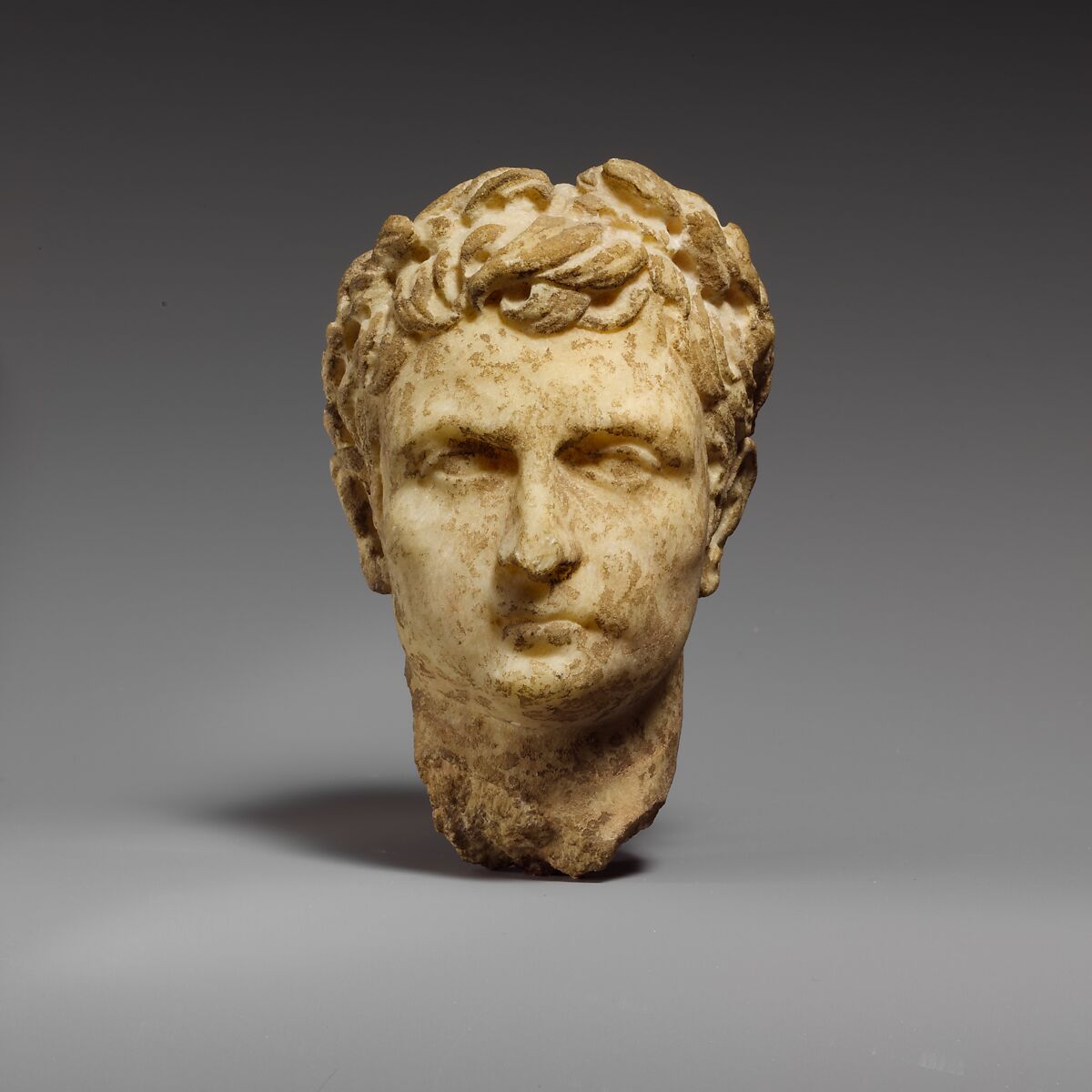 Marble head of a man wearing a laurel wreath, Marble, Roman