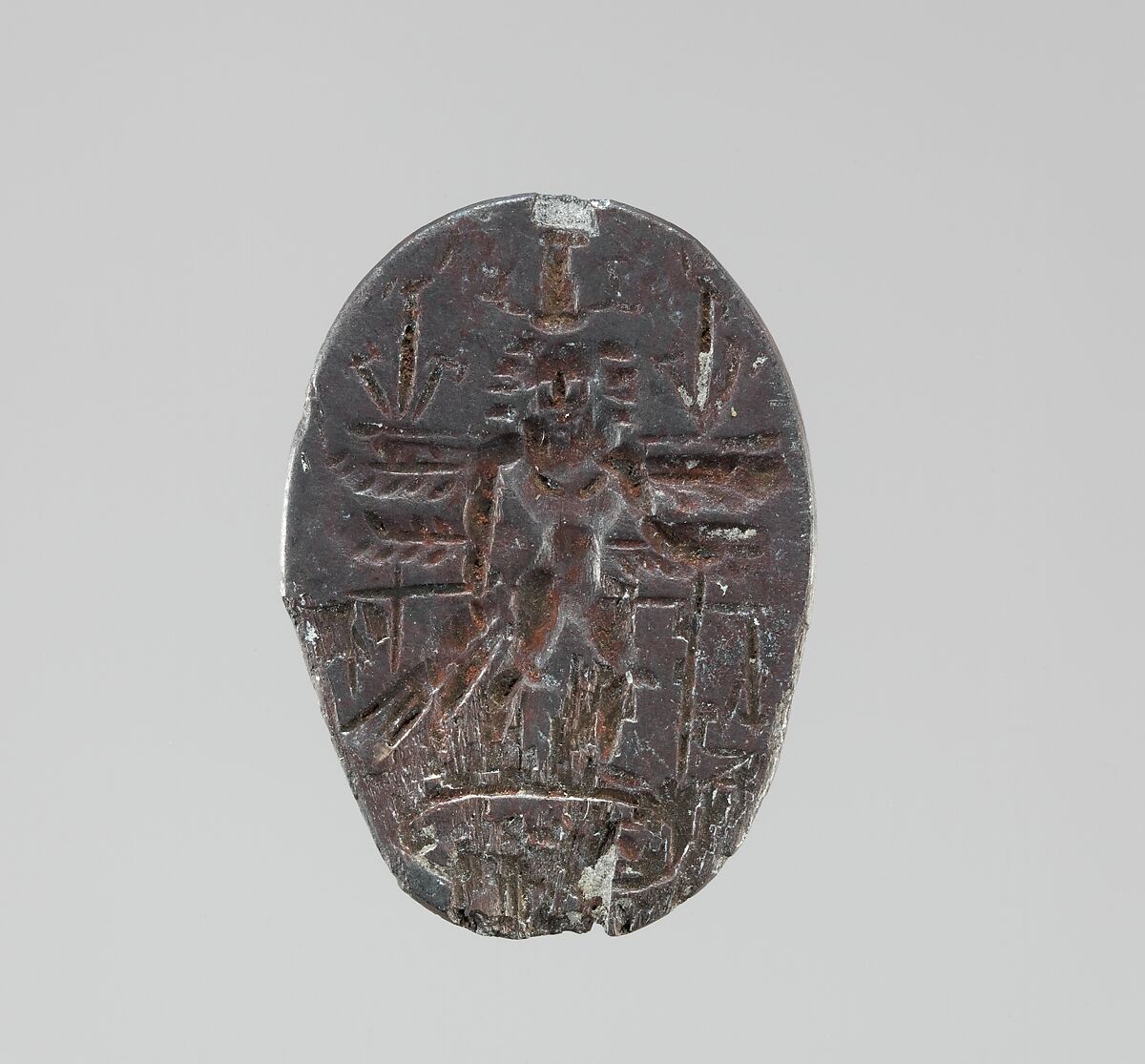 Haematite intaglio: Winged Genius, Haemaetite, Roman 