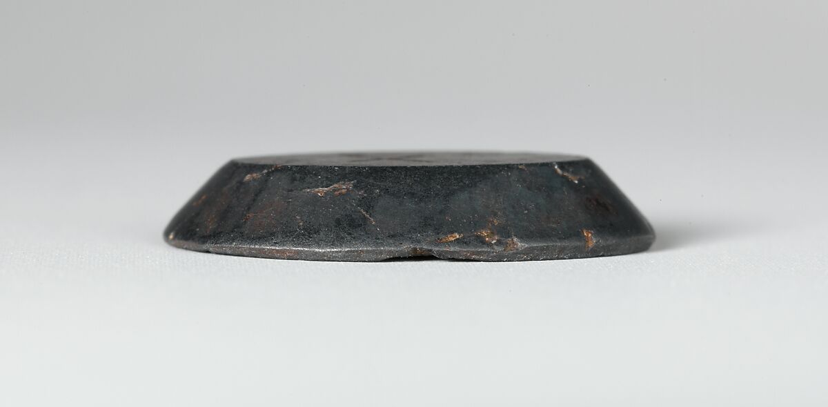 Haematite intaglio: Youth on inscribed stele, Haematite, Roman