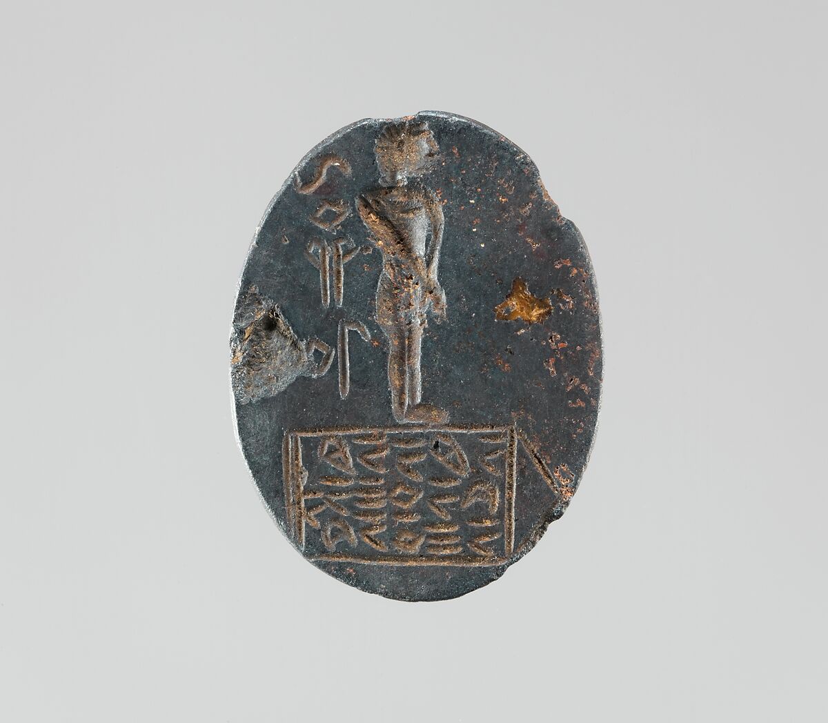 Haematite intaglio: Youth on inscribed stele, Haematite, Roman 