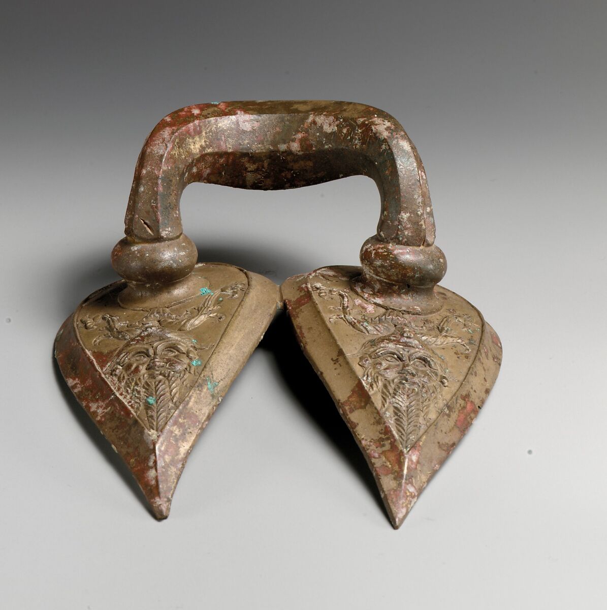 Bronze handle of a vessel with Silenos mask, Bronze, Etruscan 