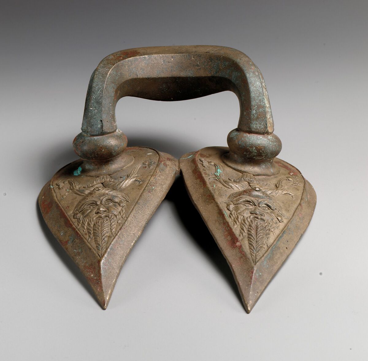 Bronze handle of a vessel with Silenos mask, Bronze, Etruscan 