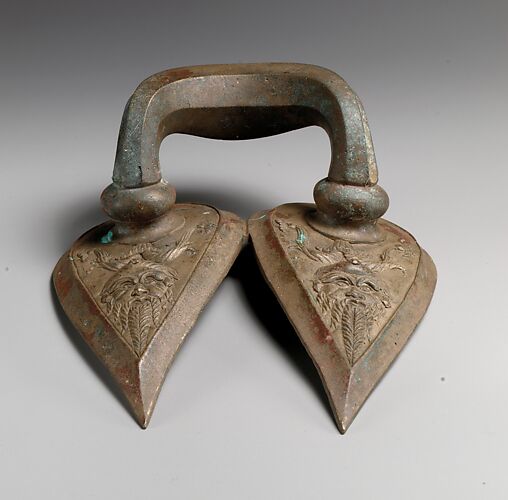 Bronze handle of a vessel with Silenos mask