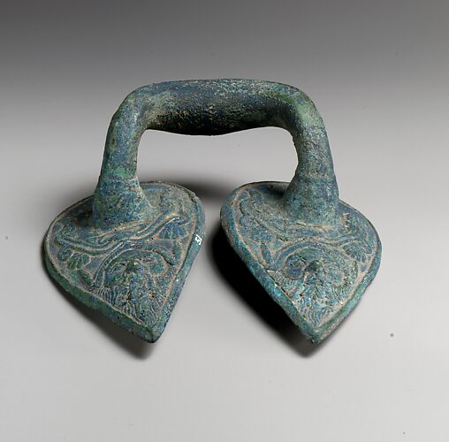 Bronze handle of a vessel with Silenos mask