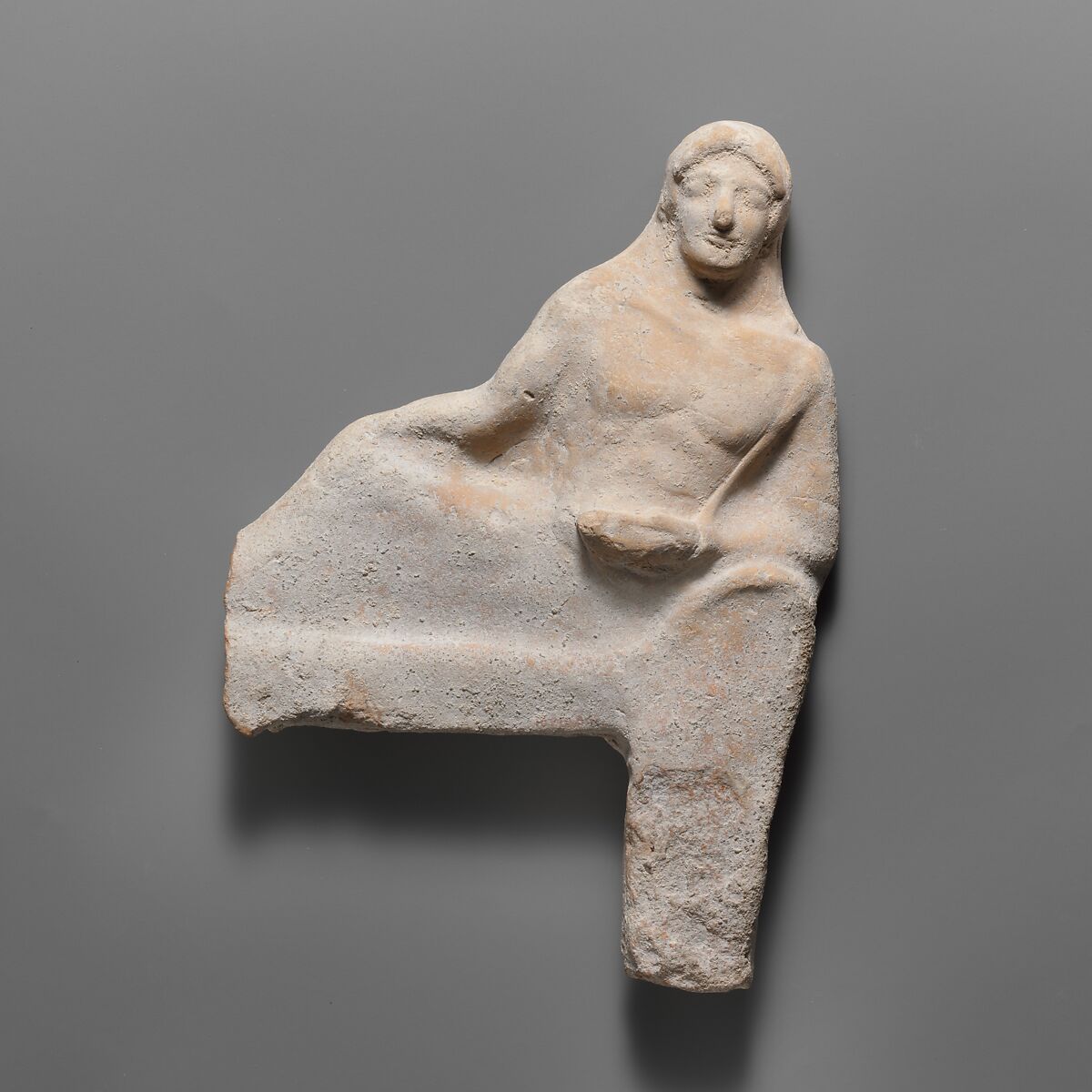 Fragmentary terracotta relief of a reclining figure, Terracotta, Greek, South Italian, Tarentine 