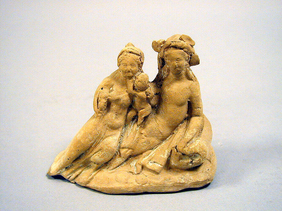 Terracotta group of a reclining youth, woman, and child, Terracotta, Greek, South Italian, Tarentine 
