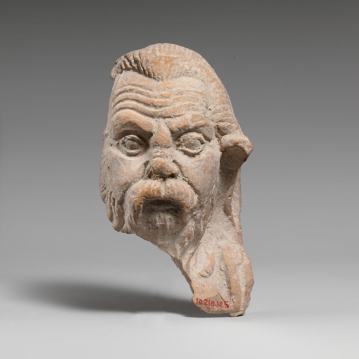 Fragment of a terracotta head of a satyr, Terracotta, Greek, South Italian, Tarentine 