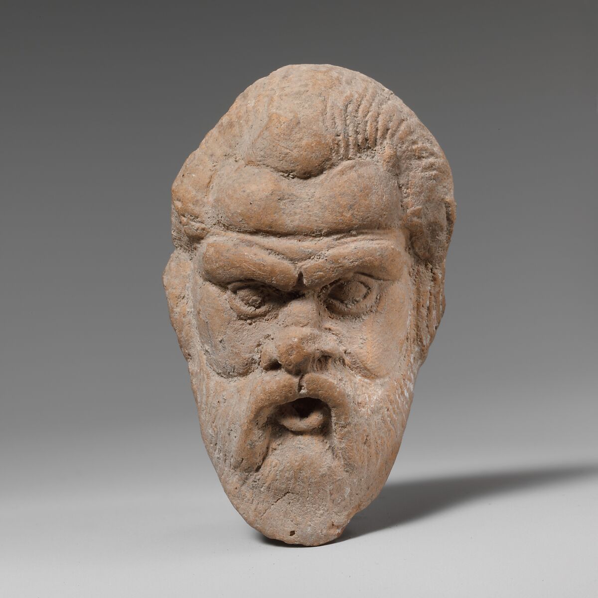 Terracotta head, possibly of a comic actor, Terracotta, Greek, South Italian, Tarentine 