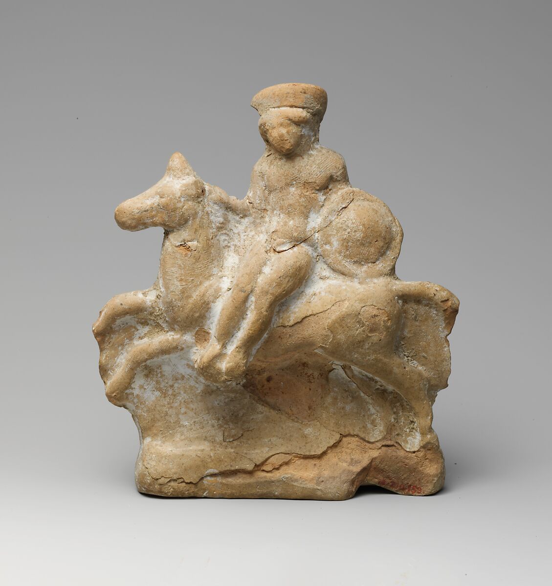 Terracotta statuette of a man seated on a horse, Terracotta, Greek 
