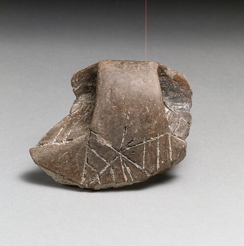 Terracotta rim fragment with handle and incised decoration