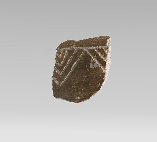 Terracotta vessel fragment with incised decoration