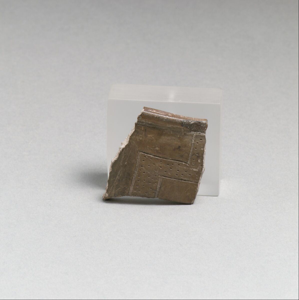 Terracotta rim fragment with incised lines and punctations, Terracotta, Cretan 