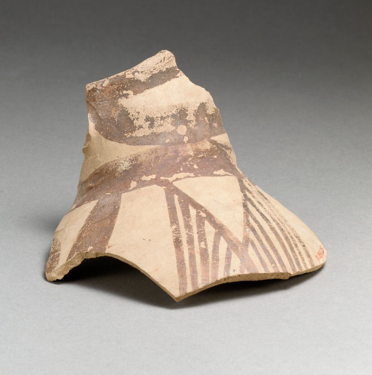 Terracotta jug fragment with bands and hatched triangles, Terracotta, Minoan 