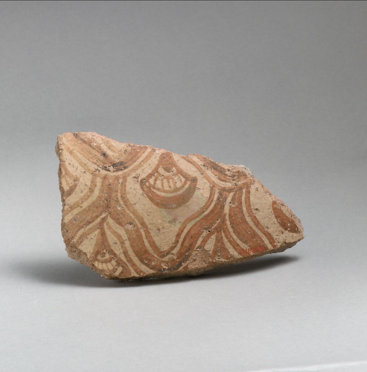 Two terracotta fragments of a large jar with reticulated pattern enclosing conventional flowers, Terracotta, Minoan 