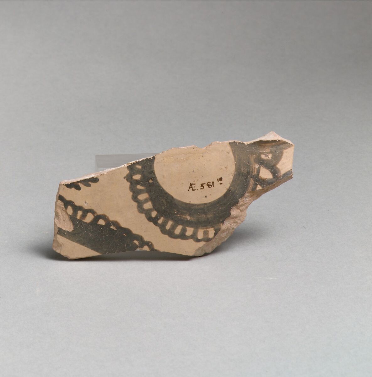 Terracotta vessel fragment with curvilinear decoration, Terracotta, Minoan 