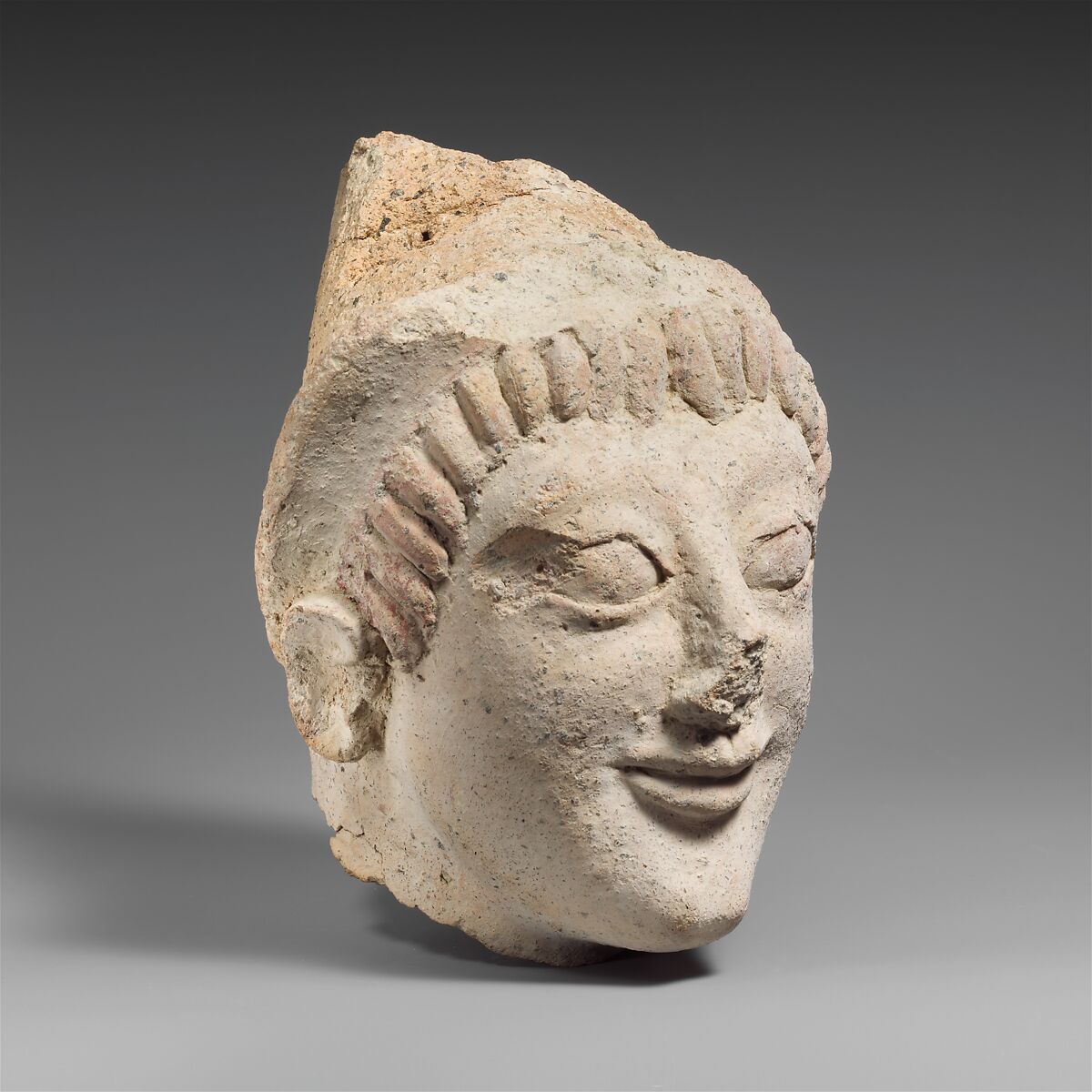 Terracotta head of a woman from a statue, Terracotta, Etruscan 