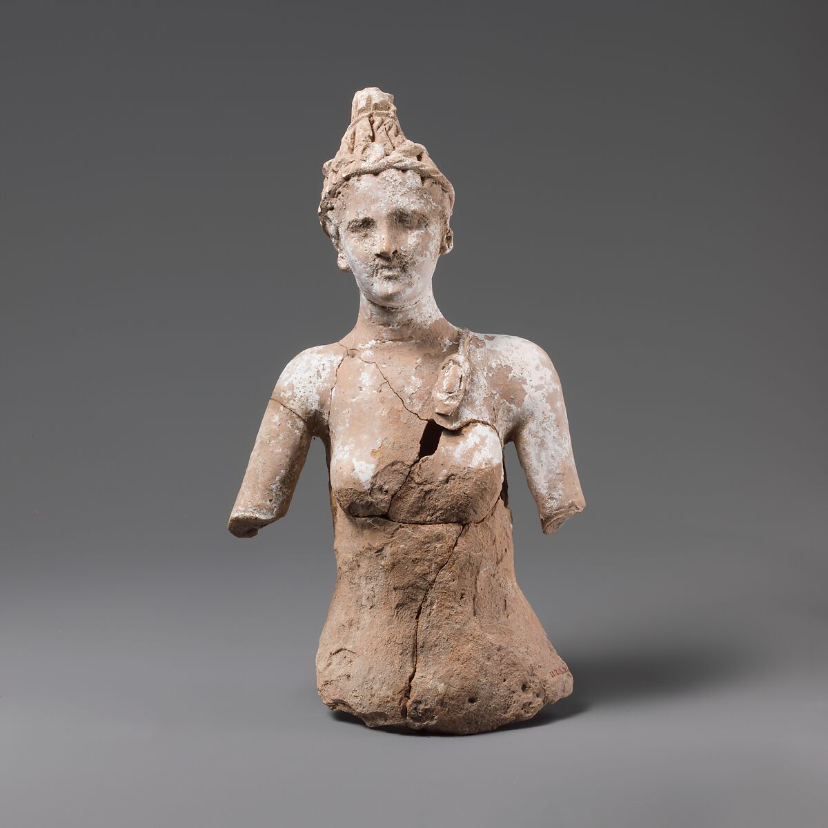 Fragmentary terracotta female statuette, perhaps Artemis, Terracotta, Greek, South Italian, Tarentine 