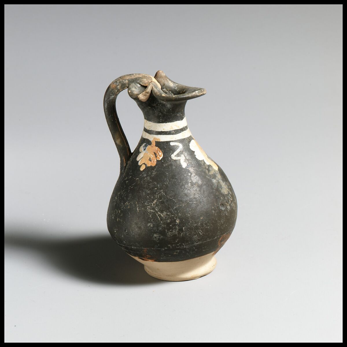 Terracotta miniature oinochoe (jug), Terracotta, Greek, South Italian, Apulian 