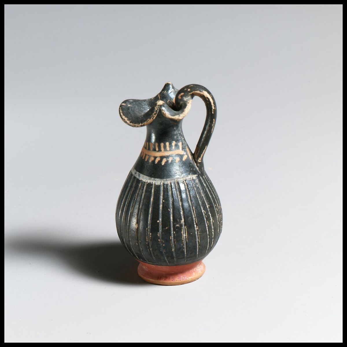 Terracotta miniature oinochoe (jug), Terracotta, Greek, South Italian, Apulian 