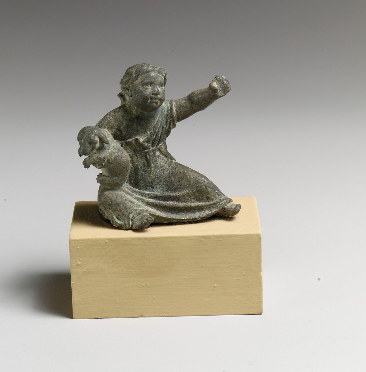 Bronze statuette of a girl holding a dog, Bronze, Greek or Roman 