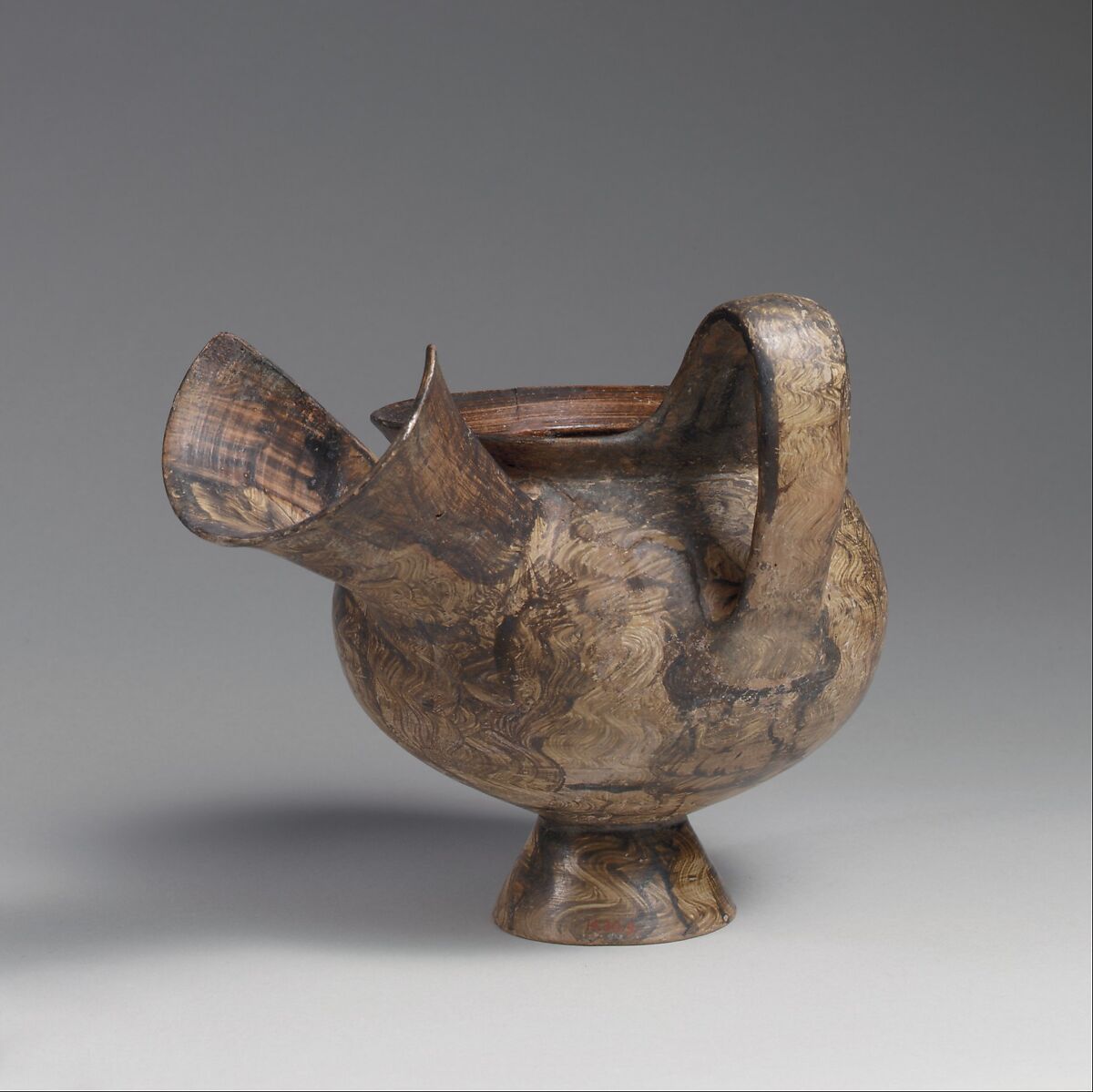 Terracotta jug with an oversize spout