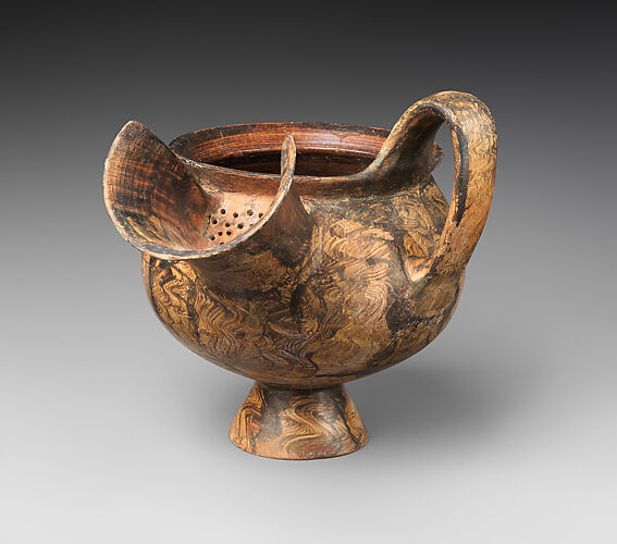 Terracotta jug with an oversize spout