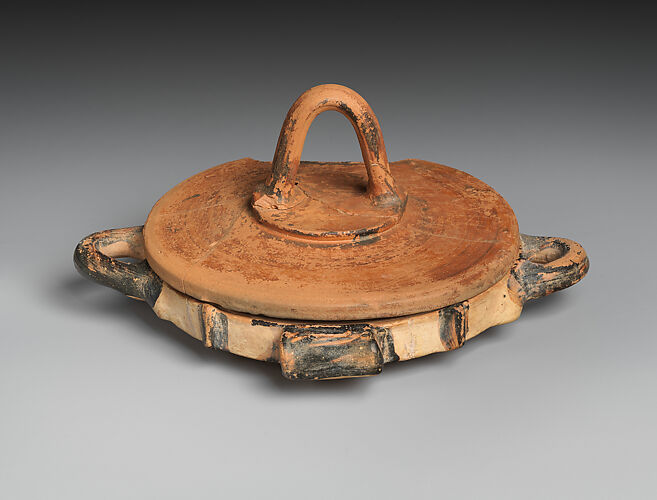 Shallow terracotta dish with lid