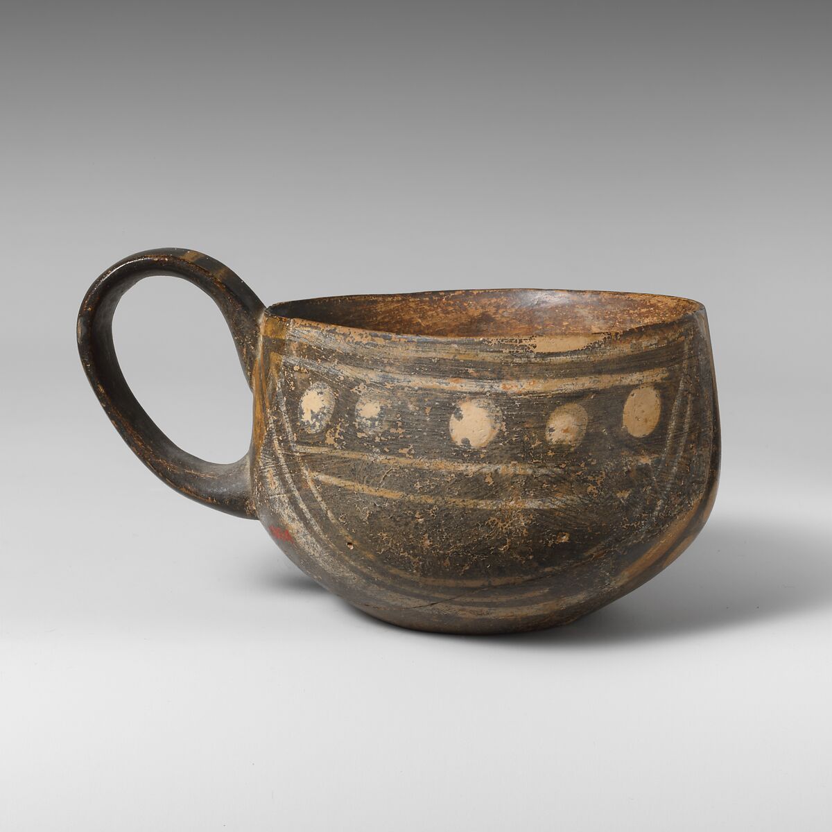 Terracotta one-handled cup, white-on-dark ware, Terracotta, Minoan 