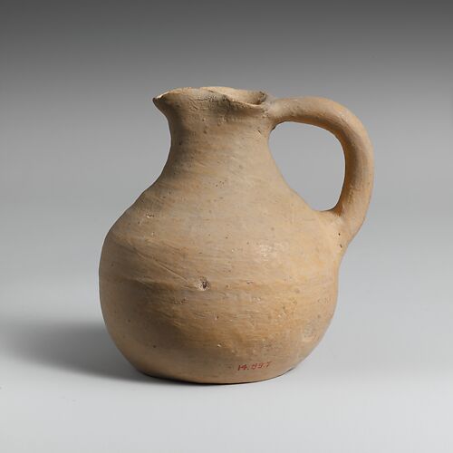 Small terracotta trefoil-mouthed jug