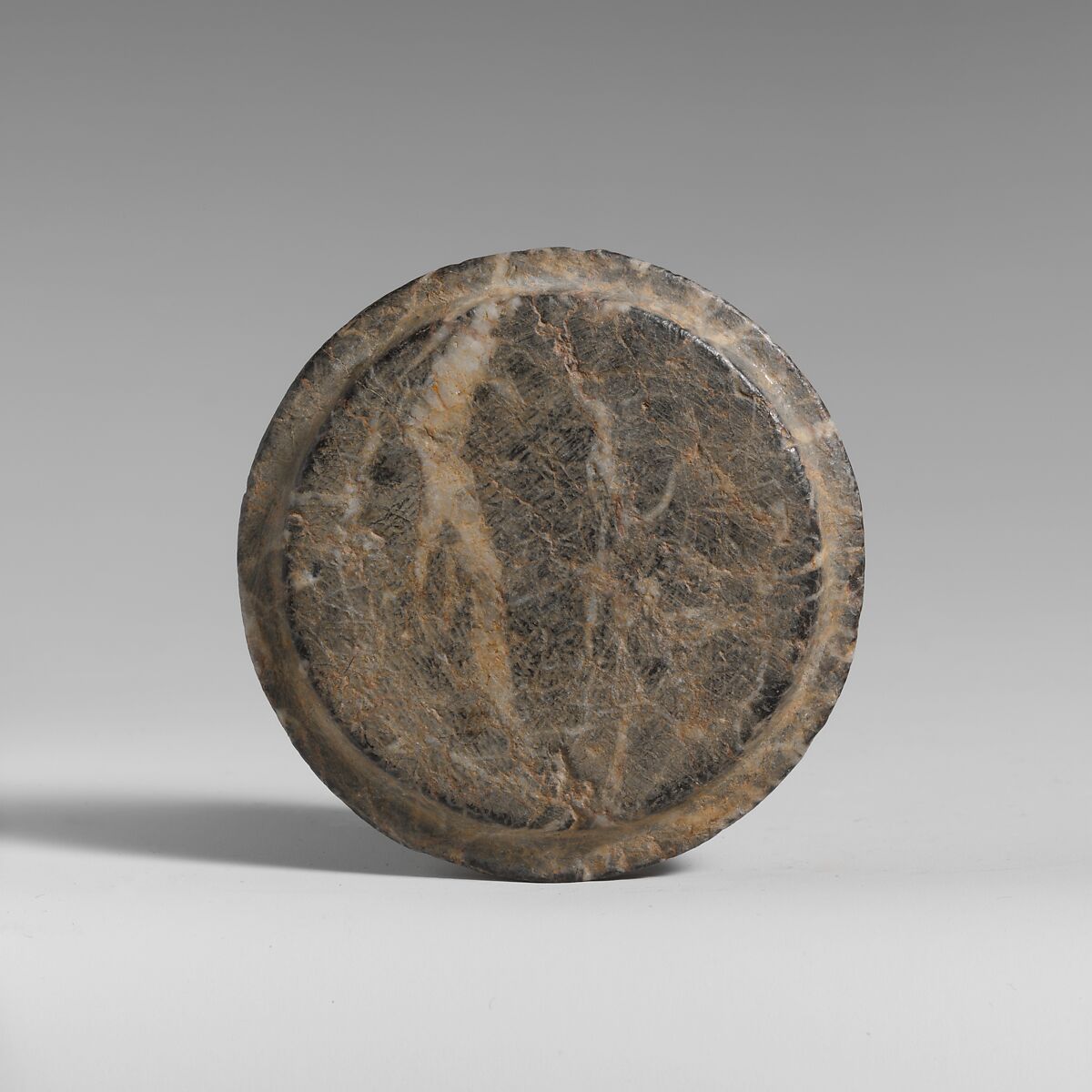 Stone lid of a pyxis, Serpentine, Minoan