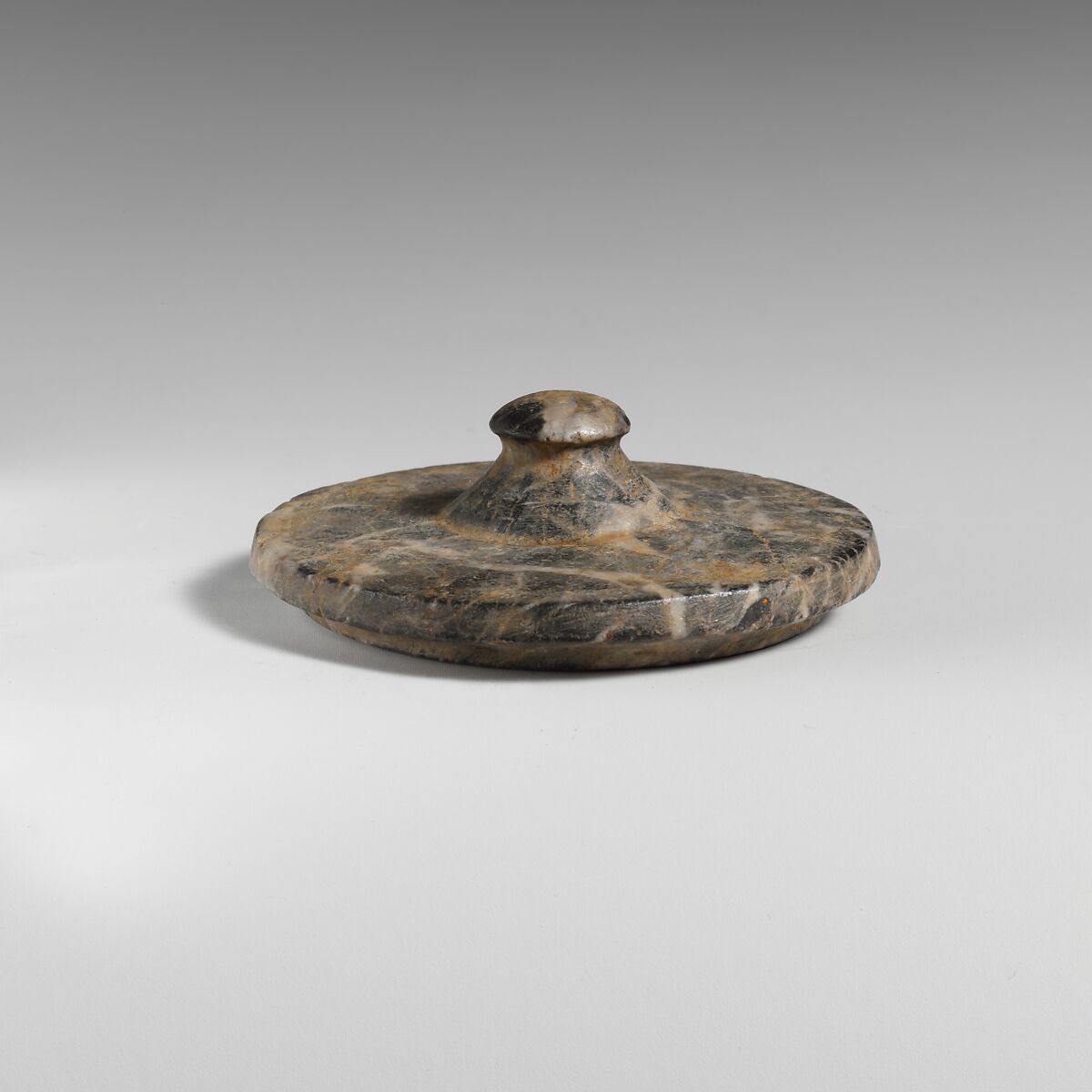 Stone lid of a pyxis, Serpentine, Minoan 