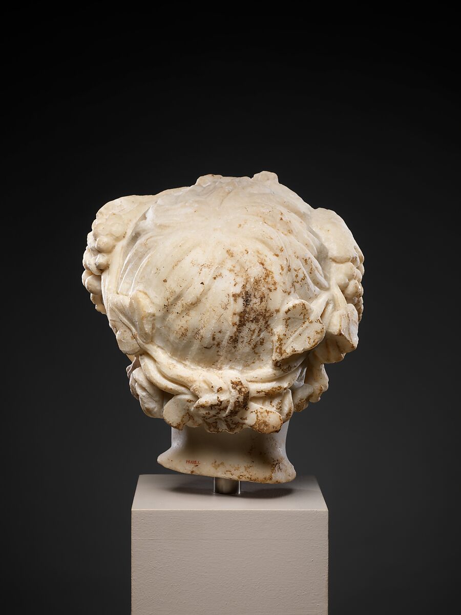 Marble head of a boy wearing a wreath, Marble, Roman