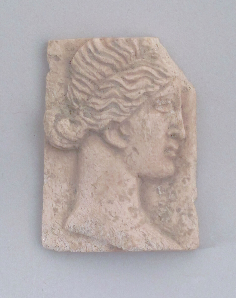 Relief of a head of woman, Ivory 