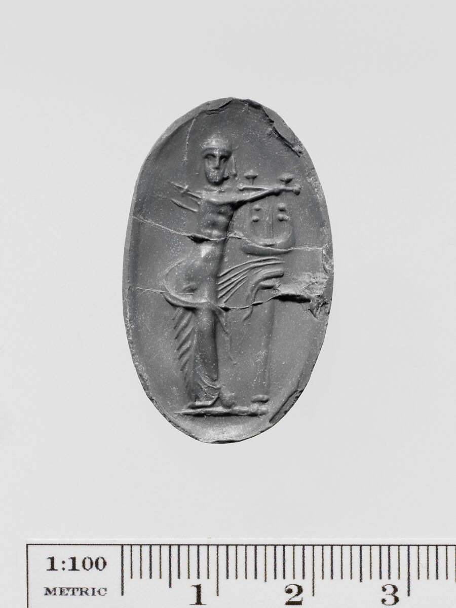 Brown glass oval set in a gilt bronze ring, Glass, brown, Greek