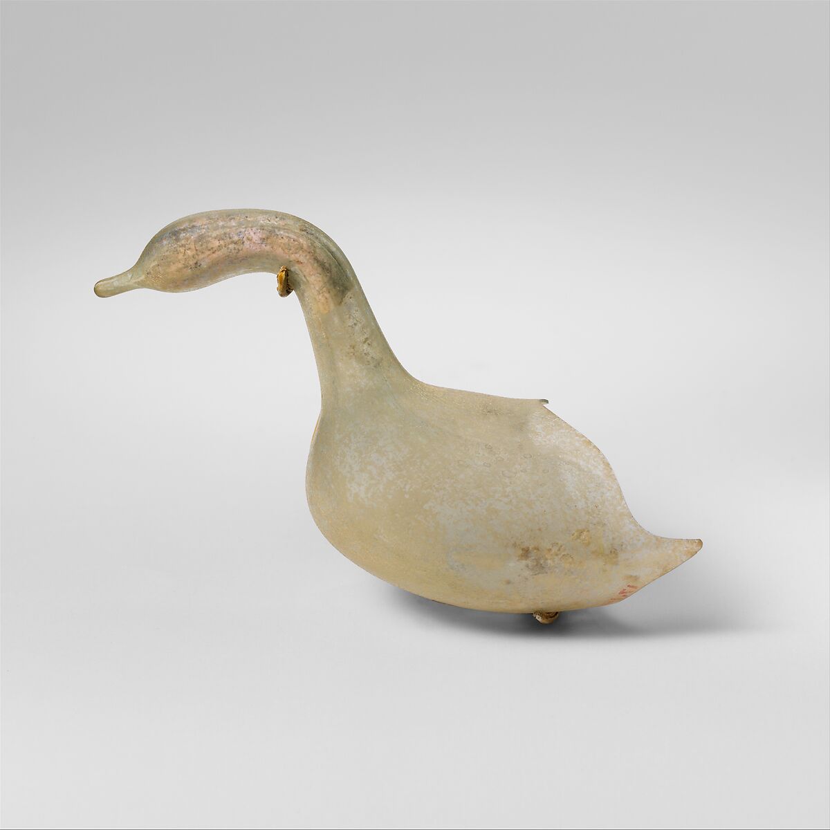 Roman bird-shaped glass vessels were used as perfume bottles. The liquid  was sealed inside the vessels and the tip of the tail had to be broken to  remove the perfume. The one