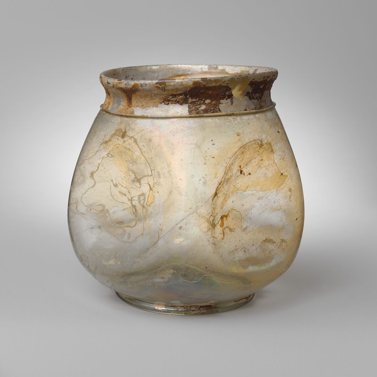 Glass beaker with indented sides, Glass, Roman 