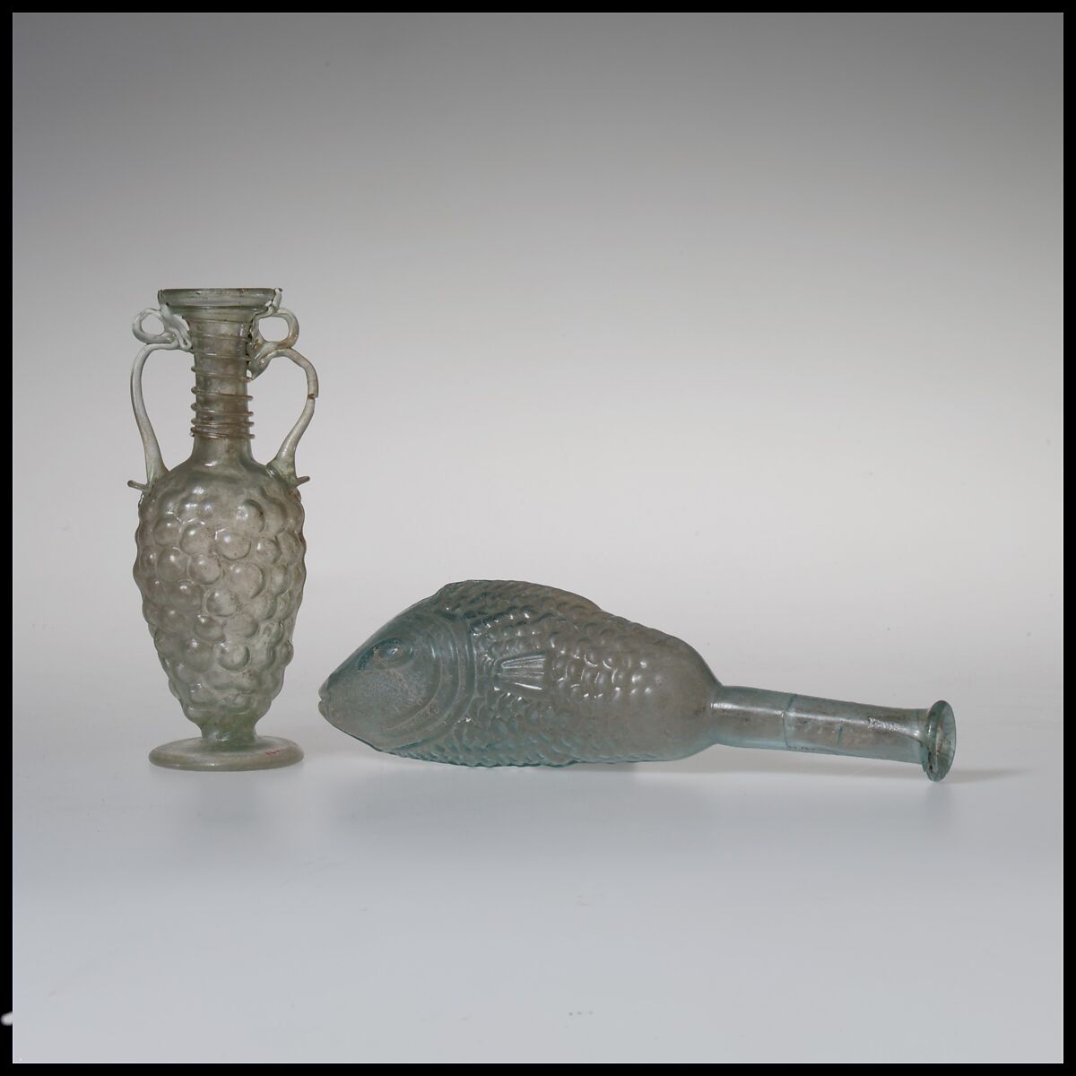 Glass bottle shaped like a bunch of grapes, Glass, Roman