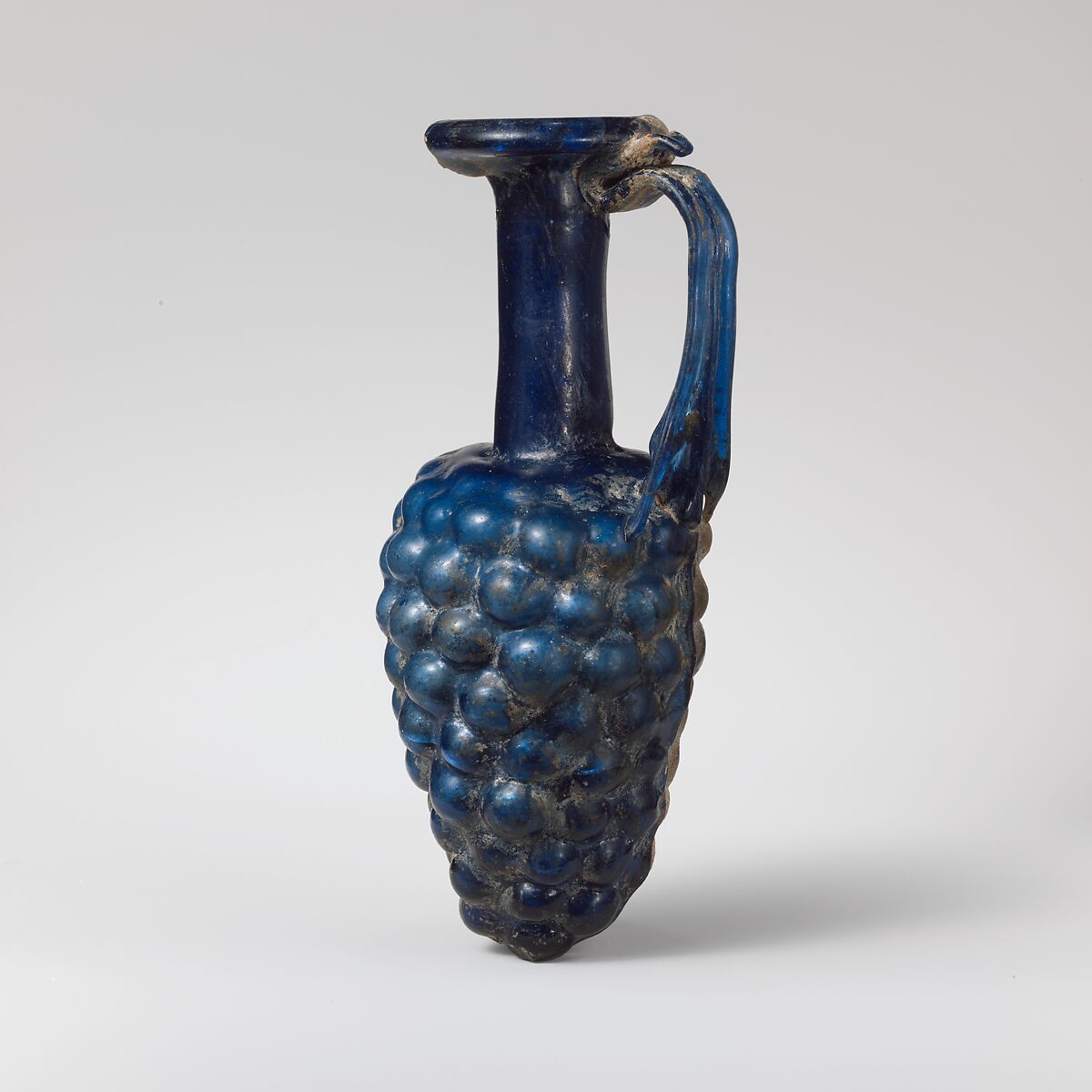 Glass jug in the shape of a bunch of grapes, Glass, Roman 