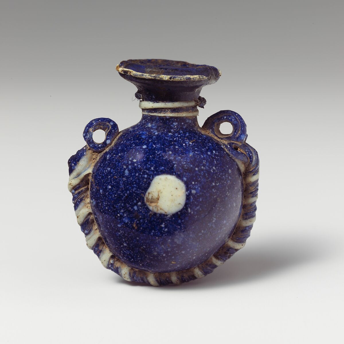 Glass lentoid aryballos (perfume bottle), Glass, Greek