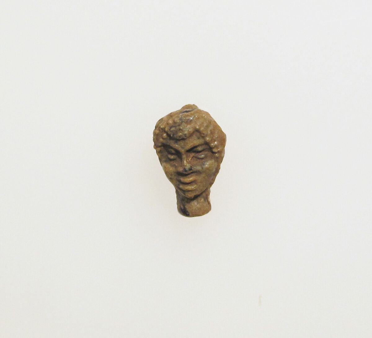 Glass pendant in the shape of a Black African's head, Glass, Greek, Eastern Mediterranean 