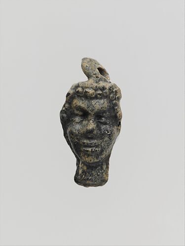Glass pendant in the shape of a Black African’s head