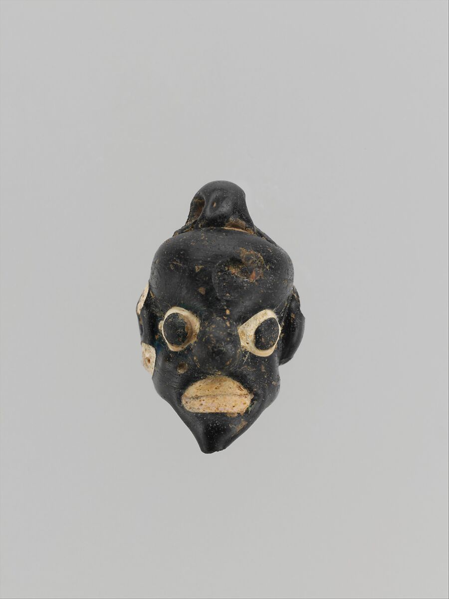 Glass pendant in the form of a demonic mask, Glass, Phoenician 