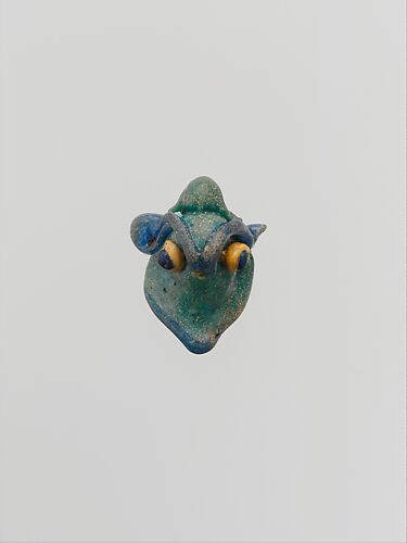 Glass pendant in the form of a demonic mask