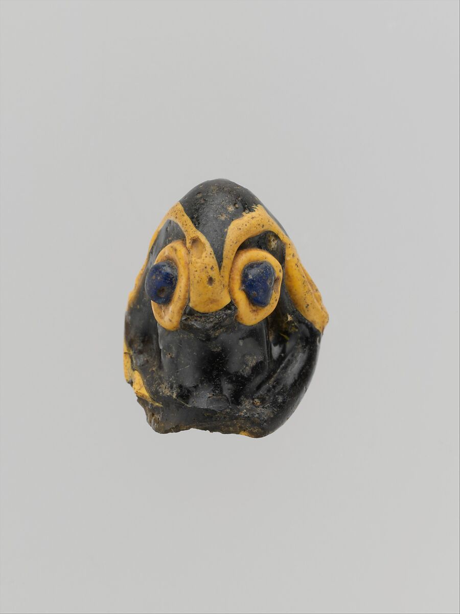 Glass pendant in the form of a demonic mask, Glass, Phoenician 