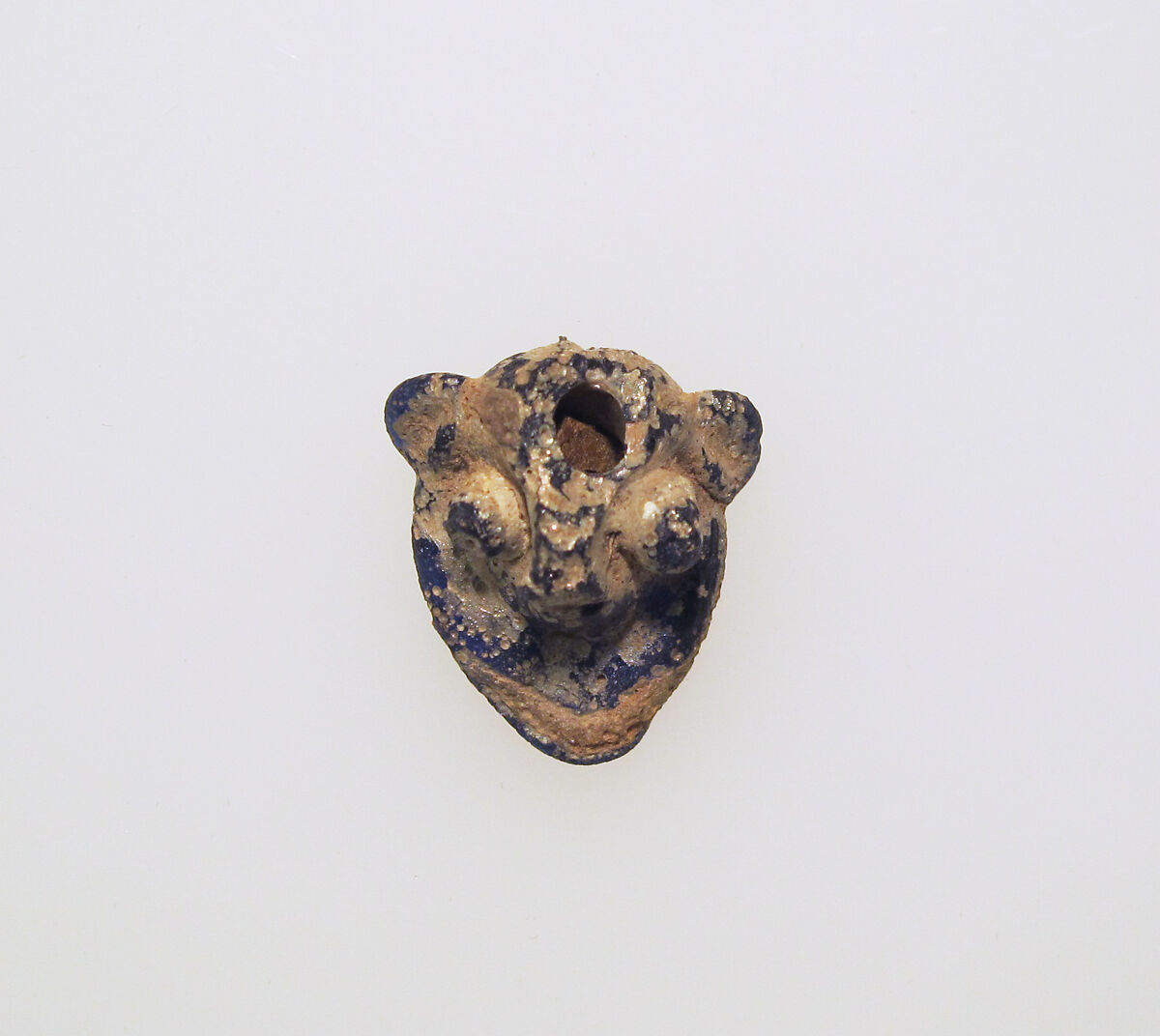 Glass pendant in the form of a demonic mask, Glass, Phoenician 