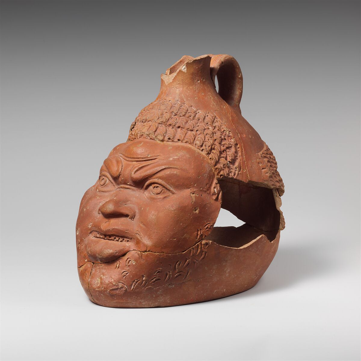 Terracotta jug in the shape of a head of a Black African, Terracotta, Roman 