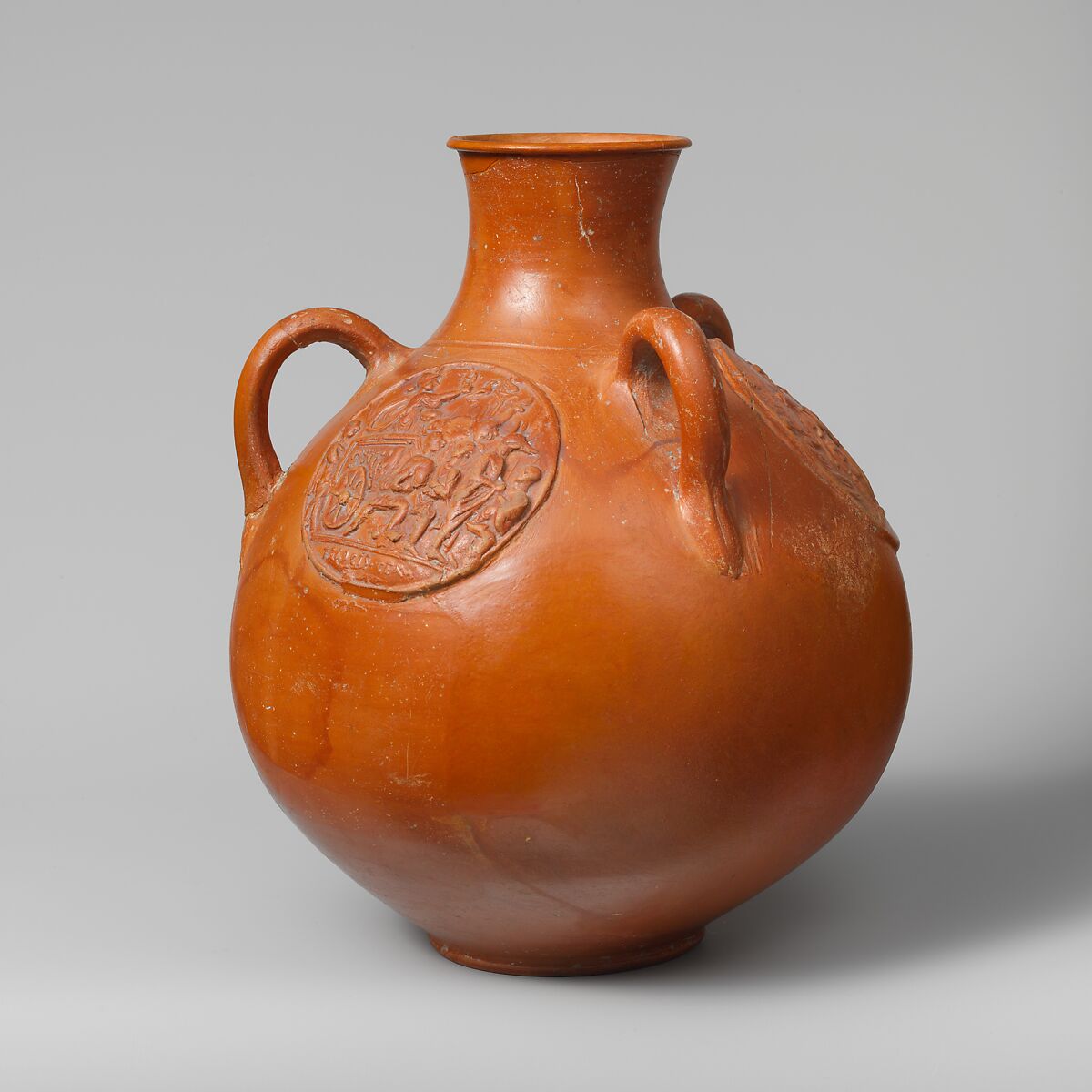 Three-handled jug with relief medallions, Terracotta, Roman 
